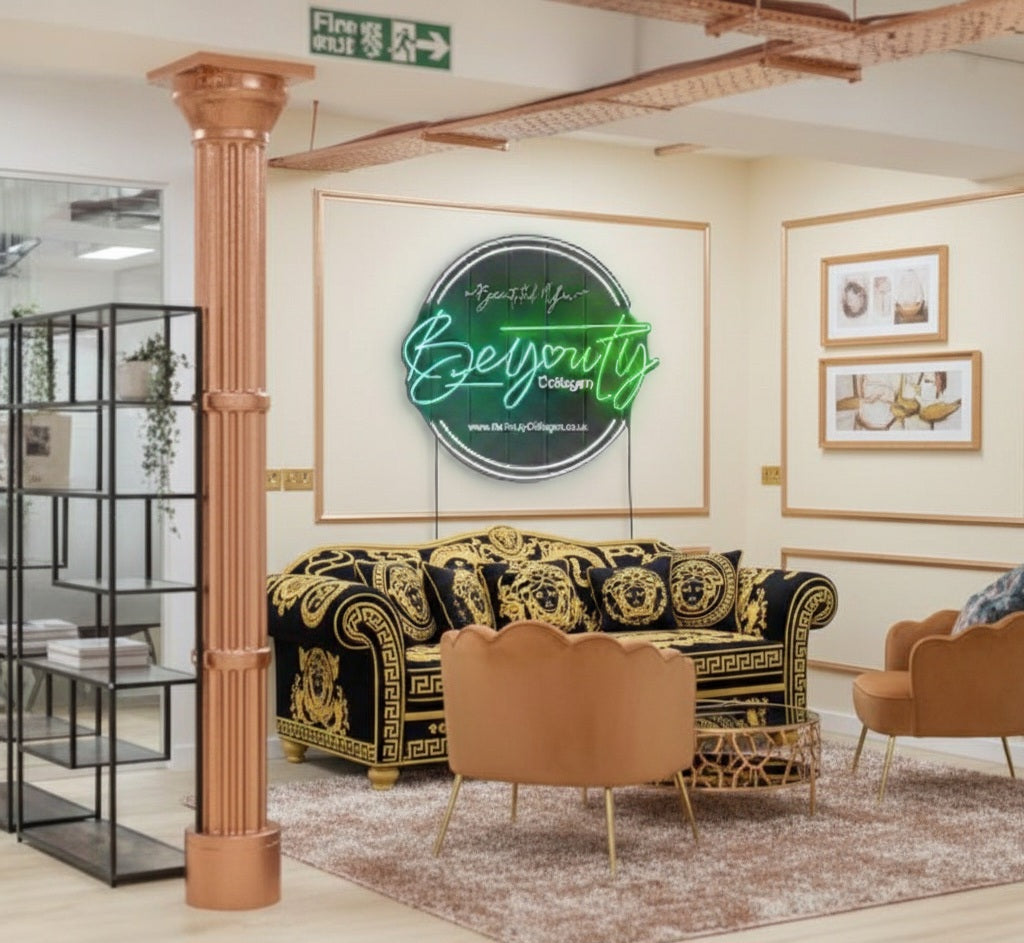 Decorative interior with a rose gold and gold sofa, gold armchair, and 'BeYouty' logo on the wall. UK registered London address of BeYouty Collagen™ is the Registered Trade Mark of BeYouty Vita Supplements Ltd. All Rights Reserved. Unauthorised use of this Trade Mark is strictly prohibited. Registered in England and Wales, CRN: 15555630 / UKTM: UK00004086801. Aldow Enterprise Park, Piccadilly Business CTR, Manchester M12 6AE "Halal collagen powder UK – BeYouty Collagen"