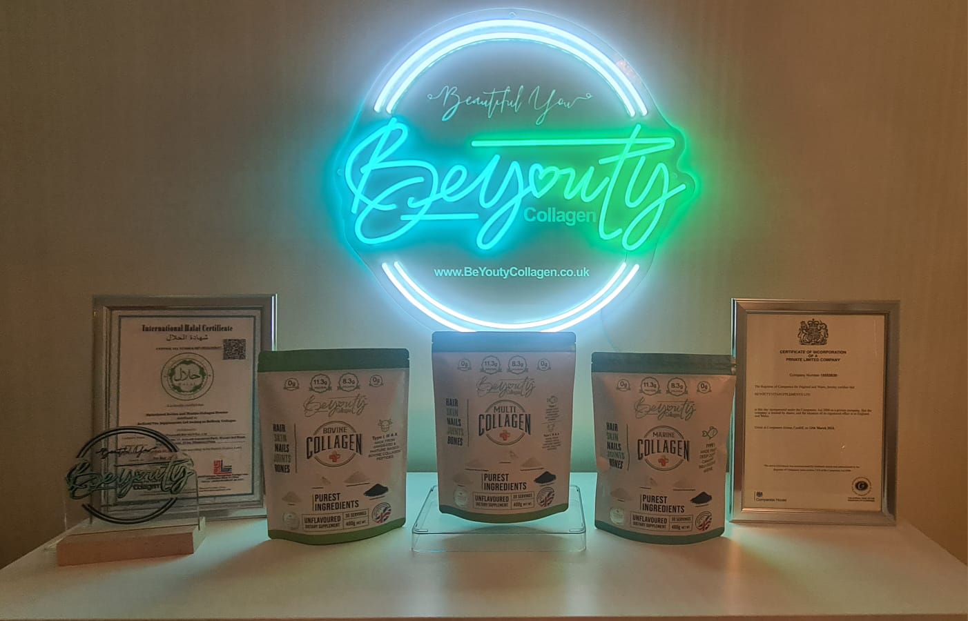 Neon sign with 'Beautiful You' and 'BeYouty Collagen' branding, surrounded by collagen product containers and certificates. Pure Halal Bovine & Marine & Multi Collagen protein powder Supplement | Type I, II, III & X  Unflavoured Halal Collagen, Halal Collagen Supplements, Hydrolysed Bovine Collagen Peptides Powder, Hydrolysed Marine Collagen Peptides Powder,
Hydrolysed Multi Bovine & Marine Collagen Peptides Powder, Hydrolysed Collagen Peptides Powder UK, Buy Halal Collagen UK, Pure Hydrolysed Collagen "Hal